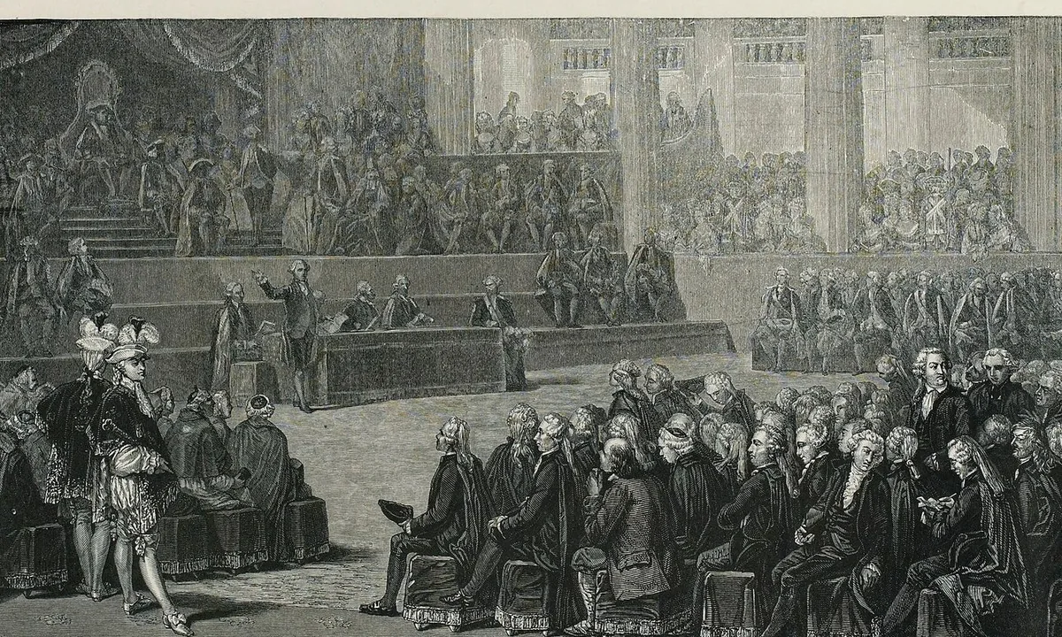Black-and-white print of a vast hall with the king on a dais at the far end and deputies in rows facing each other.
