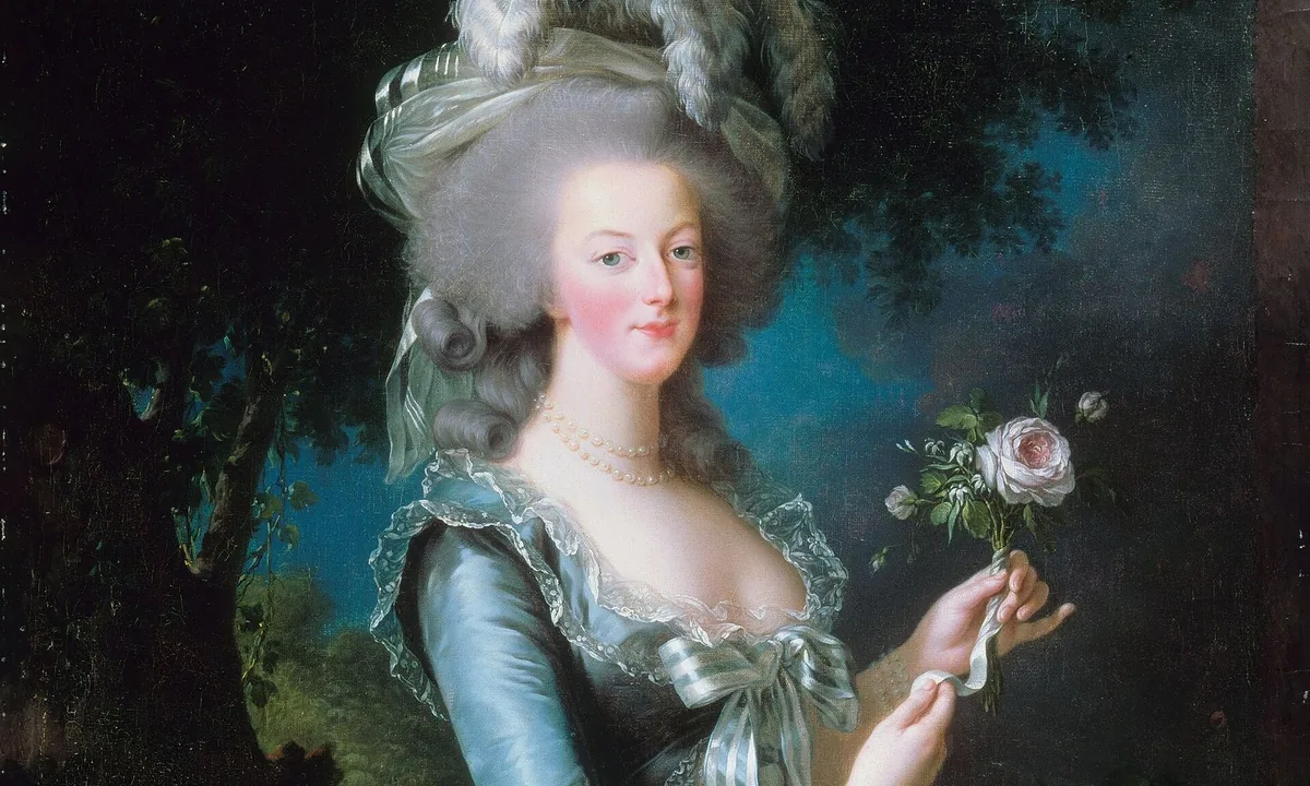 Portrait of Marie Antoinette in a blue-grey silk gown and plumed powdered hair, holding a pink rose against a dark wooded background.