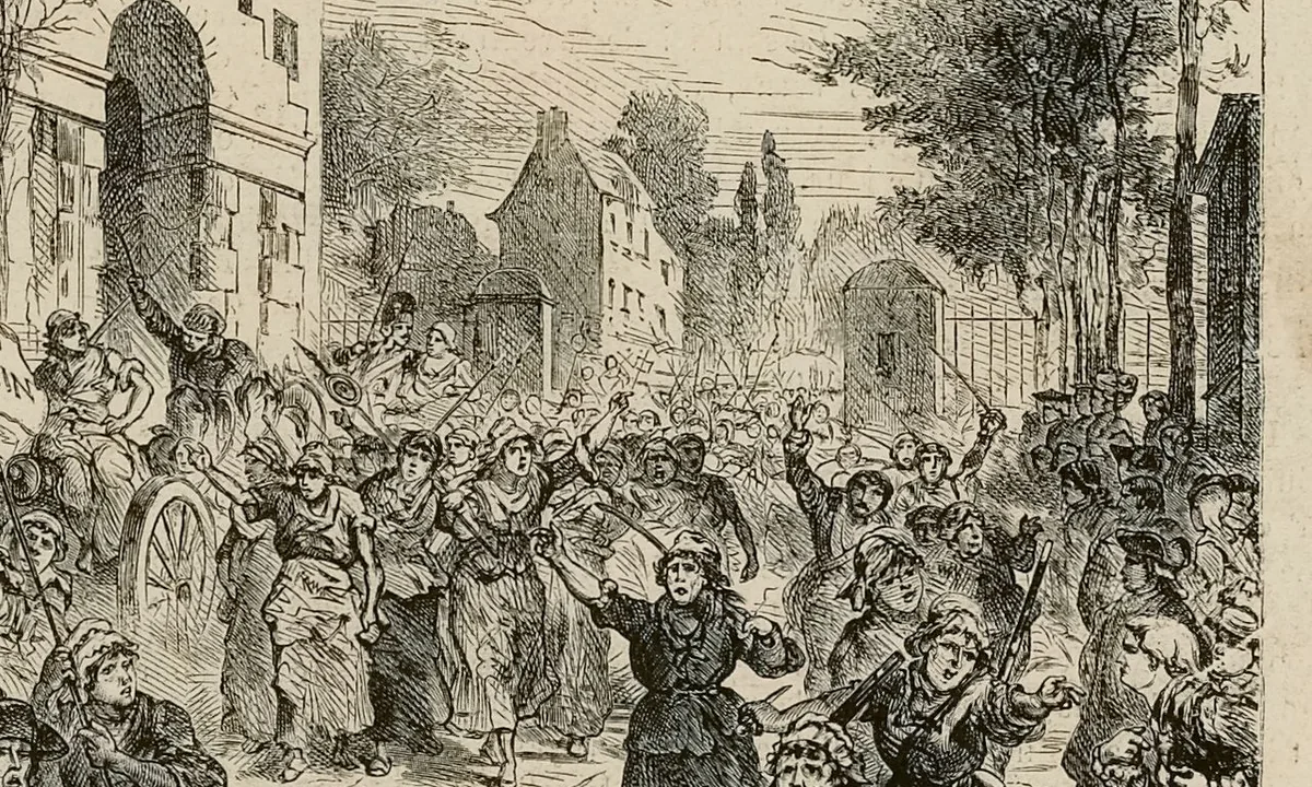 Black-and-white engraving of a crowd of women, some armed with pikes, marching along a street past houses and trees.