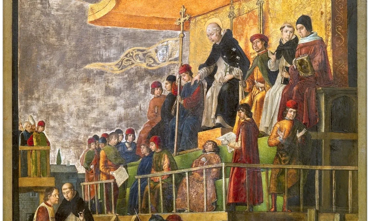 Panel painting of a haloed friar seated on a canopied platform among officials, above a crowd where two bound men stand on a pyre and others wear tall pointed hats.