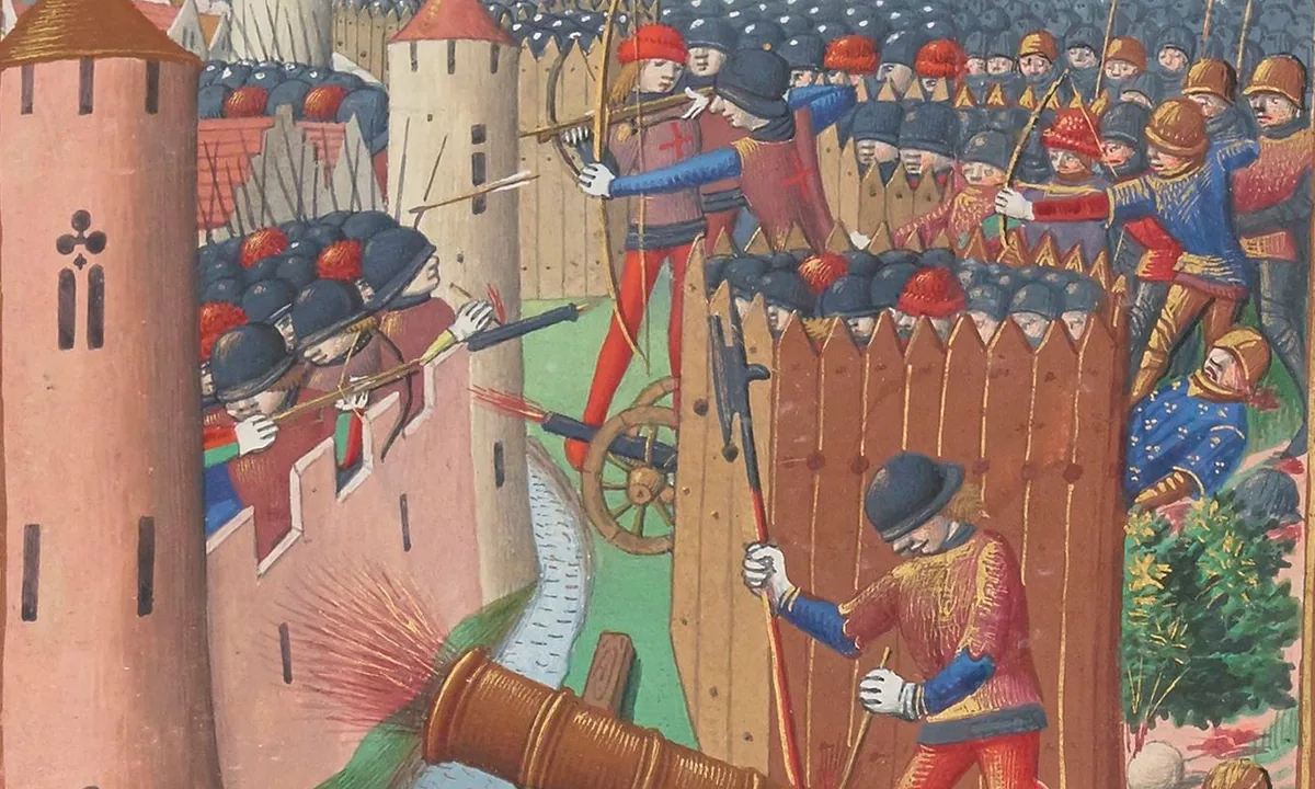 Medieval manuscript painting of archers shooting from behind wooden palisades at a walled town, with a large bronze cannon firing at a round tower.