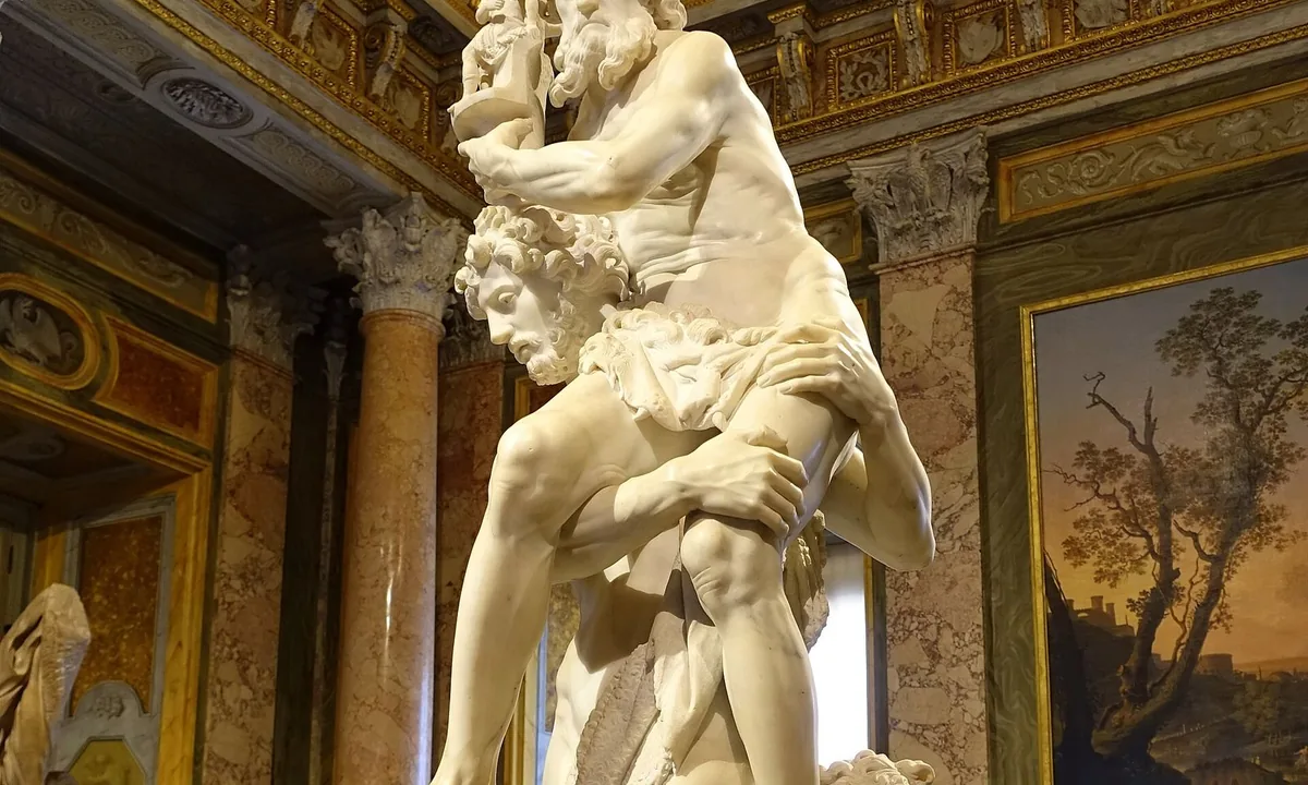 Marble sculpture of a young man carrying an old man on his shoulder, with a small boy at his feet.