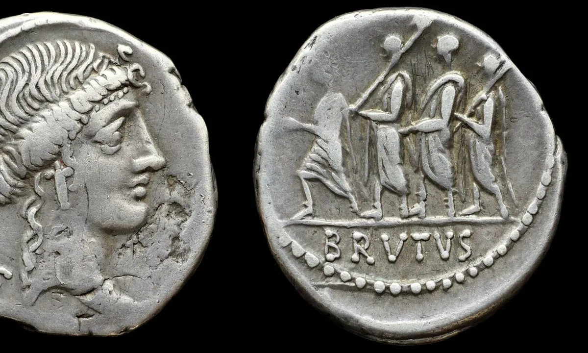Worn silver Roman coin showing a small procession of figures, one carrying bundles of rods, with the word BRVTVS.