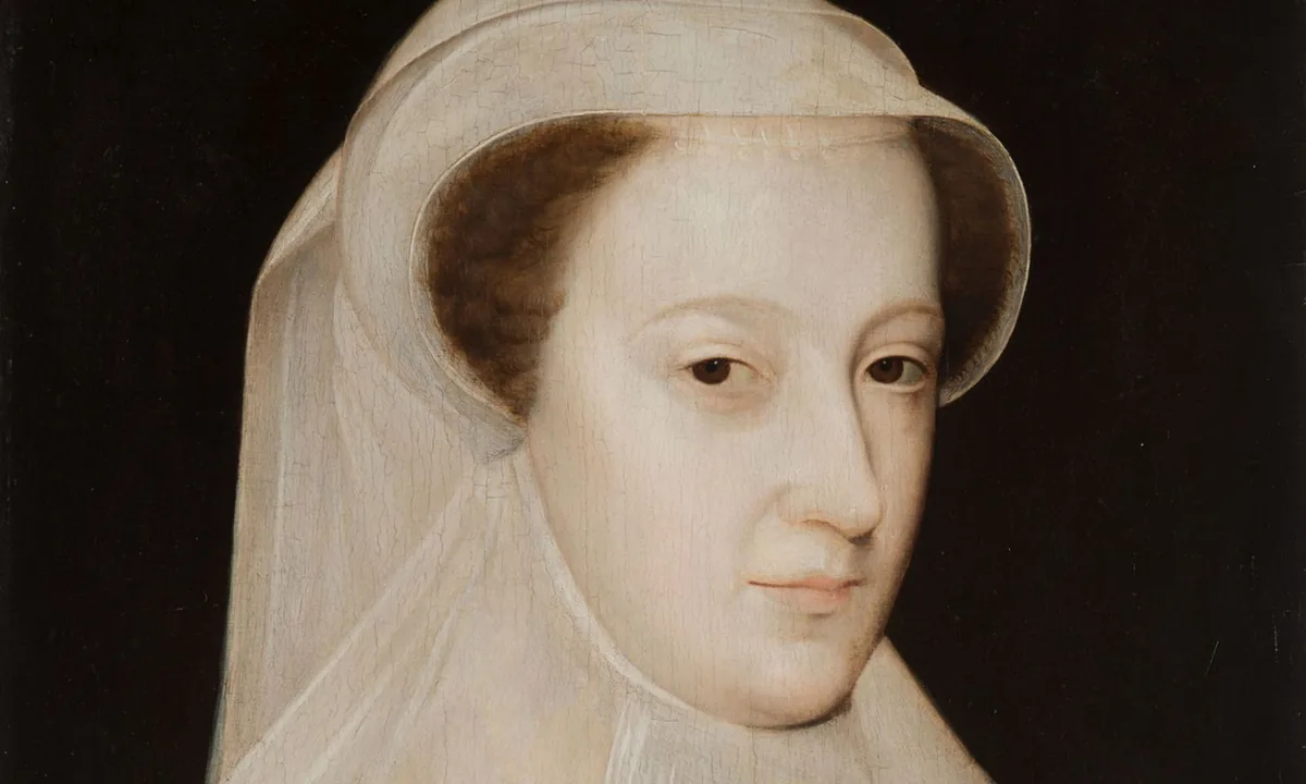 Portrait of a young woman with auburn hair in a white veil and white mourning dress against a black background.